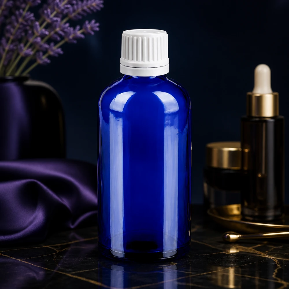 100ml Tropfflasche 0.7mm weiß Originalitätsverschluss BlueLine UT18/100 Nachfüllbare Tropfflasche 100ml aus recycelbarem blauen Glas mit auslaufsicherem weißem Verschluss
