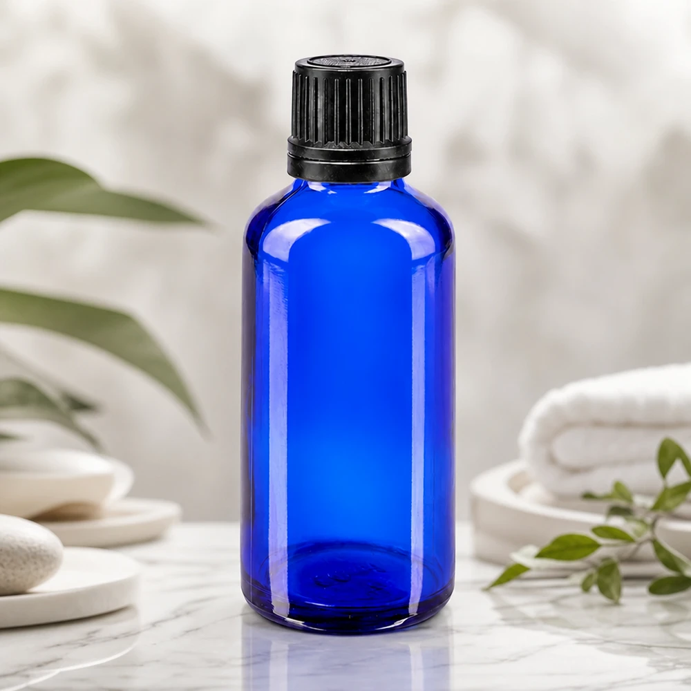 Apothekenflasche blau 50ml Tropfverschluss Giessring 1mm schwarz Originalitätsverschluss Blaues Apothekenglas 50ml mit präzisem 1mm Tropfeinsatz für Kosmetik und Naturheilkunde