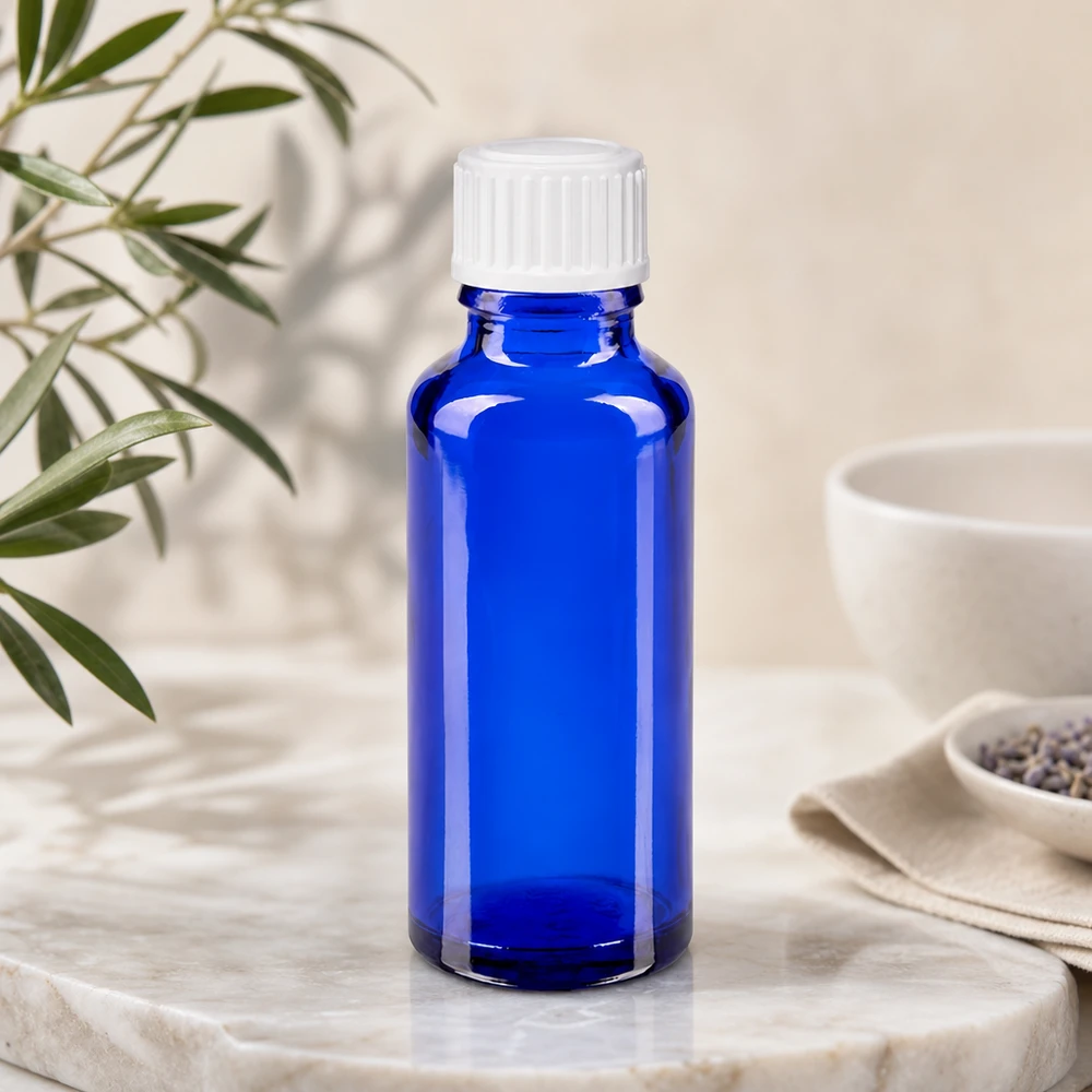 Kleine blaue 30ml Glasflasche mit weißem Verschluss für ätherische Öle und Essenzen