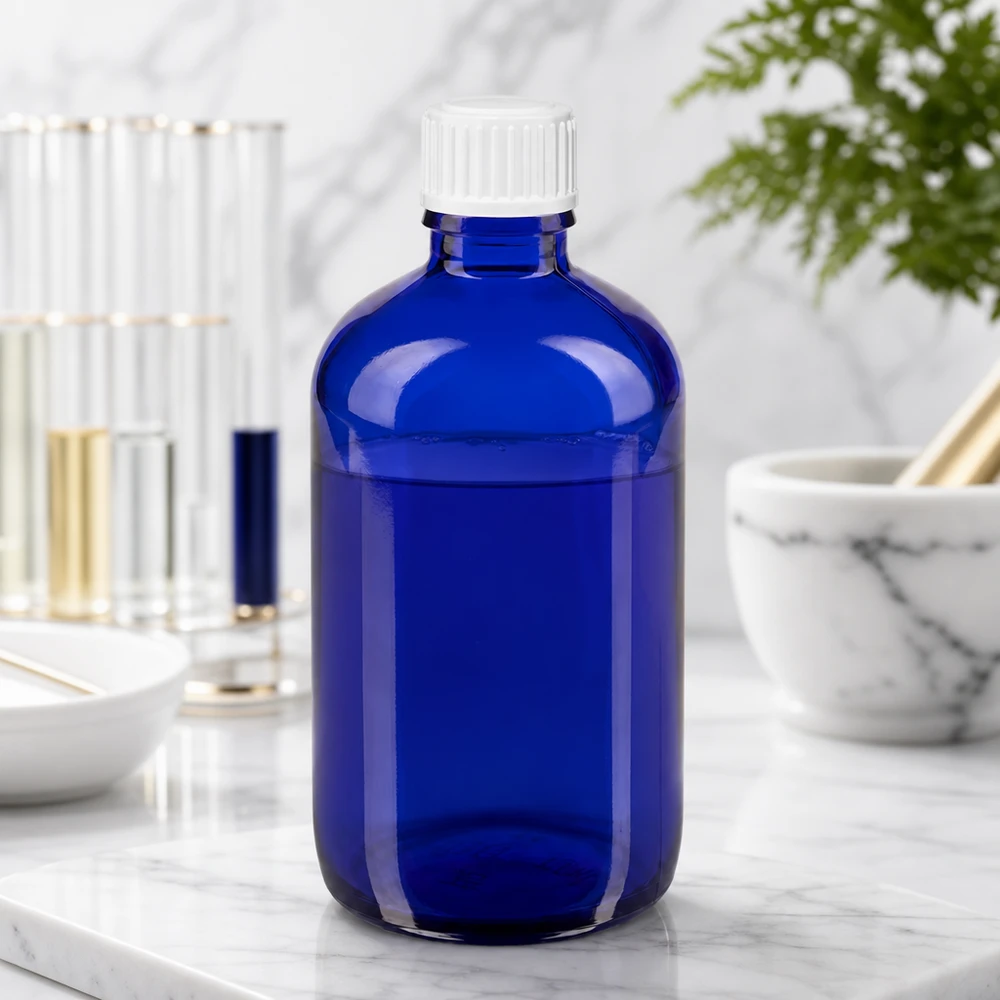 Blaue 100ml Rundflasche mit weißem Schraubverschluss und 0.9mm Tropfeinsatz für Naturheilkunde