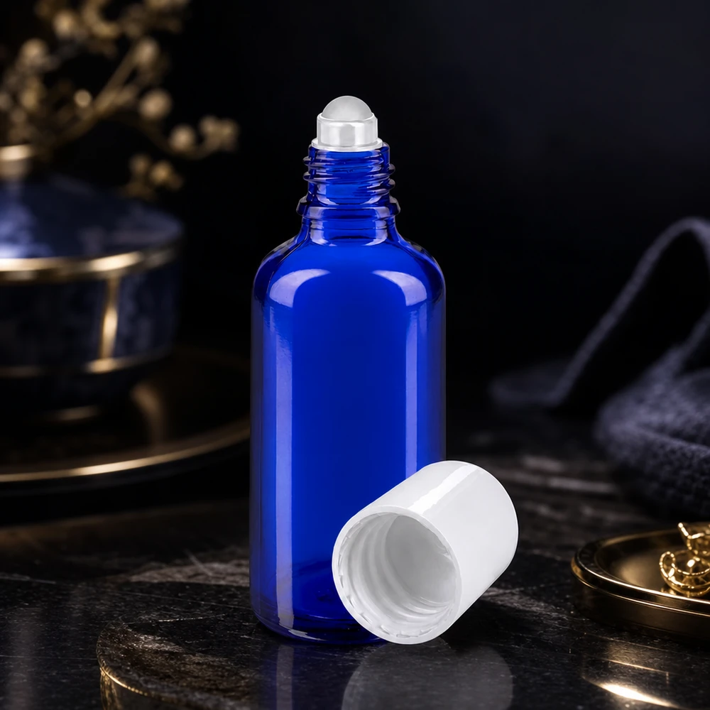 Apothekenflasche blau 50ml Roll-On Verschluss weiß Blaue lichtschutzende 50ml Apothekerglasflasche mit Rollkugel ideal für Seren und Pflegeöle