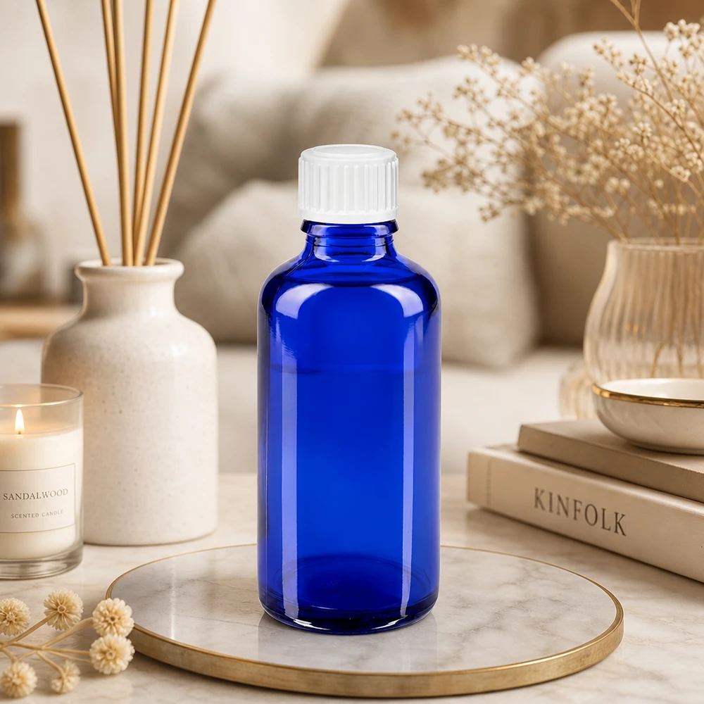 UV-schützende blaue 50ml Apothekerflasche mit weißem 11mm Verschluss aus Glas